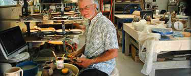 David Cuzick working in his studio