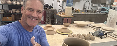 David Cuzick working in his studio
