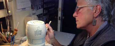 Nan Coffin working in her pottery studio.